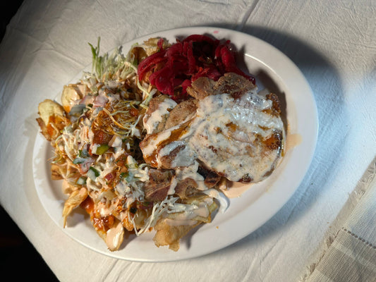 Chuleta con tajadas, pork chop with banana slices